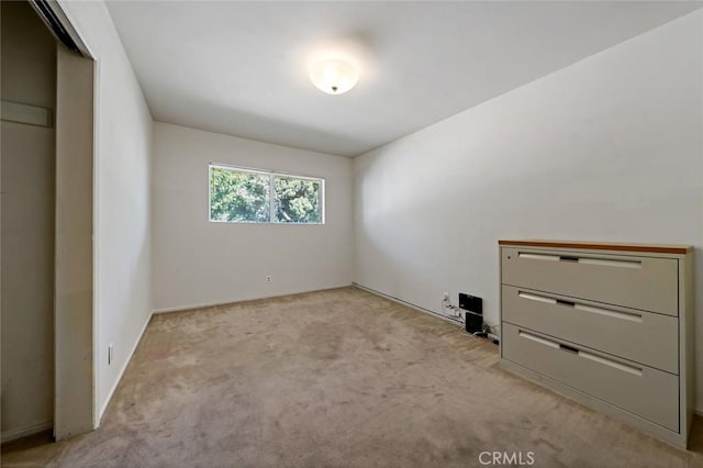 interior space featuring light colored carpet