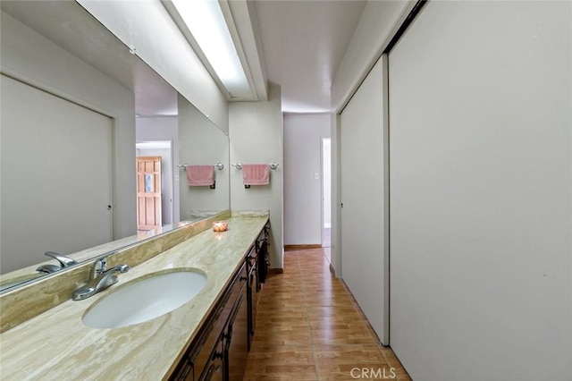 bathroom featuring hardwood / wood-style flooring and vanity