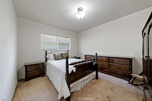 bedroom featuring light carpet