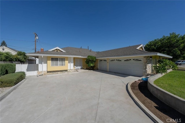 ranch-style house featuring a garage