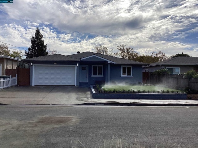 ranch-style home with a garage