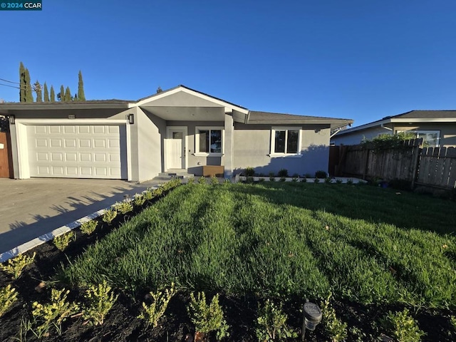 single story home with a front yard and a garage