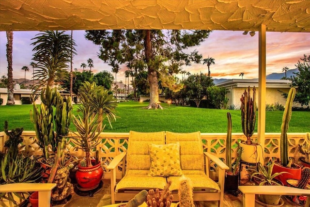 patio terrace at dusk with a lawn