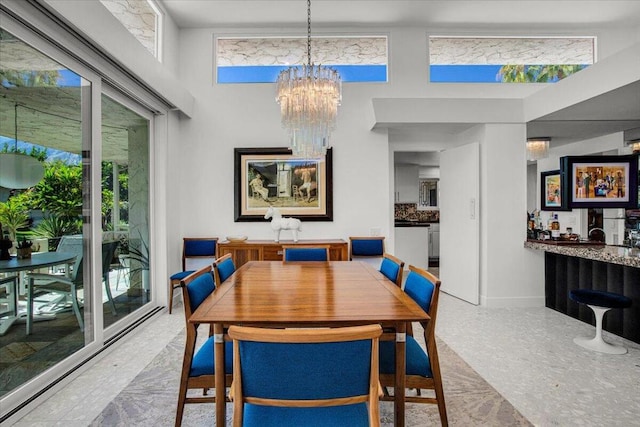 dining room with a notable chandelier