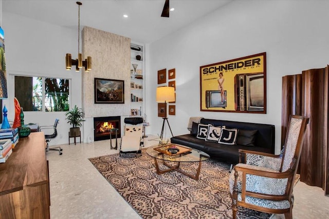 living room with built in features and a fireplace