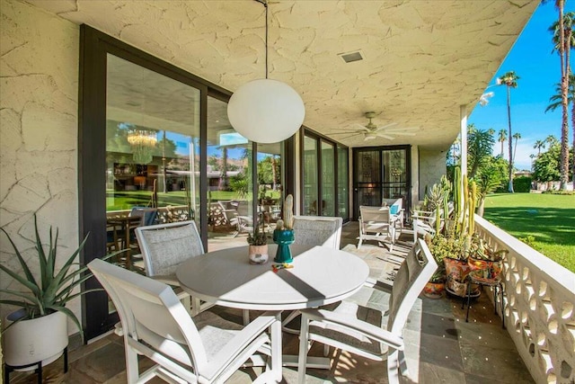 view of patio featuring ceiling fan