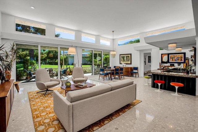 living room with a towering ceiling