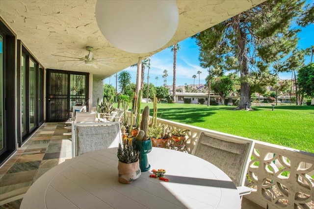 view of patio / terrace featuring ceiling fan