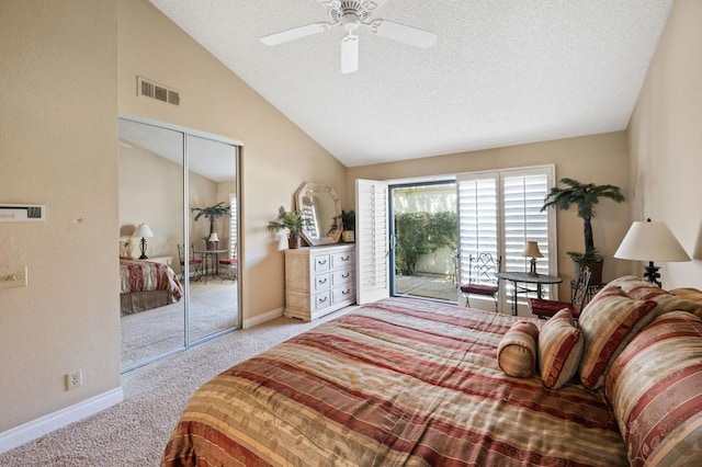 carpeted bedroom featuring a textured ceiling, ceiling fan, a closet, and vaulted ceiling