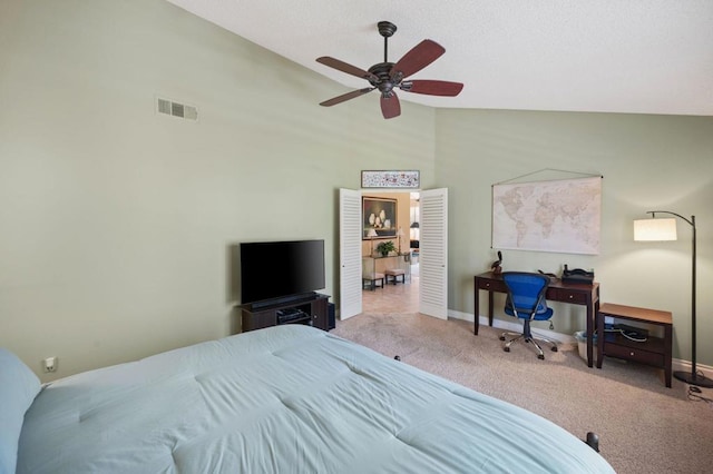 carpeted bedroom featuring ceiling fan and high vaulted ceiling