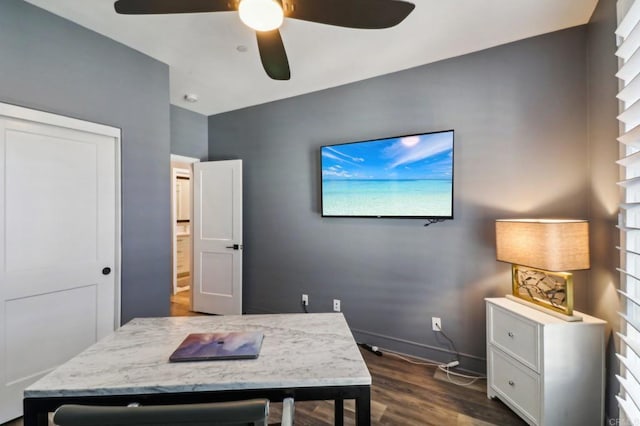 office with ceiling fan, dark wood-type flooring, and baseboards