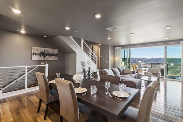 dining room with recessed lighting, visible vents, wood finished floors, and stairway