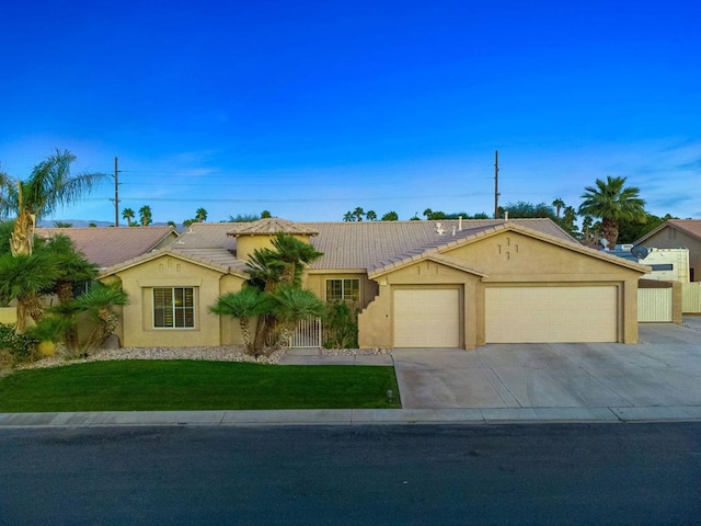 ranch-style house with a front lawn and a garage