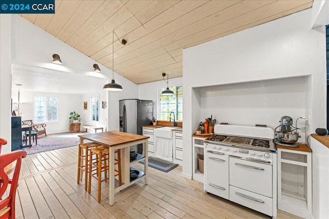 kitchen featuring white range with gas cooktop, wood ceiling, lofted ceiling, and white cabinets