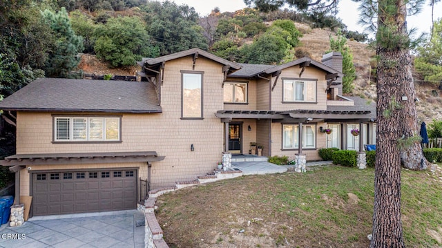 view of front of house with a front lawn and a garage