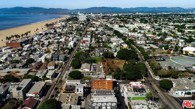 bird's eye view with a water and mountain view