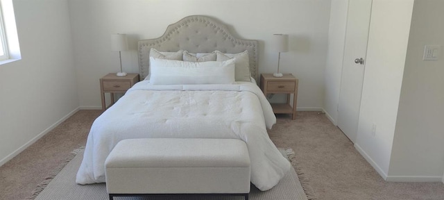 bedroom with light colored carpet