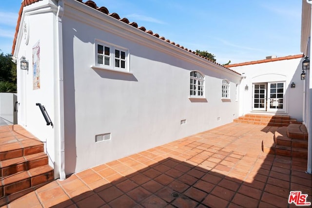 view of patio / terrace featuring french doors