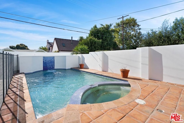 view of swimming pool featuring an in ground hot tub and pool water feature