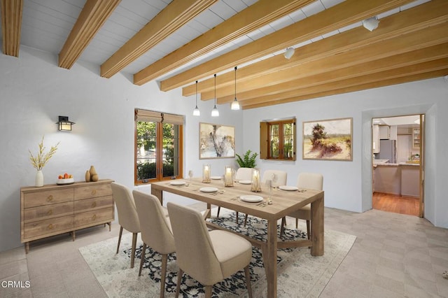 dining room featuring beam ceiling