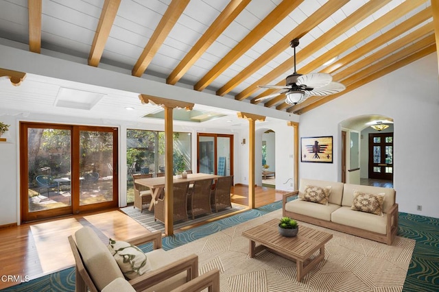 living room featuring ceiling fan, beam ceiling, french doors, and high vaulted ceiling