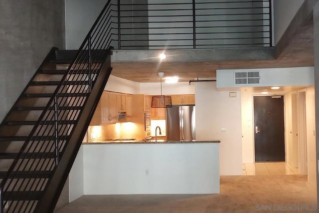 kitchen with stainless steel refrigerator and sink