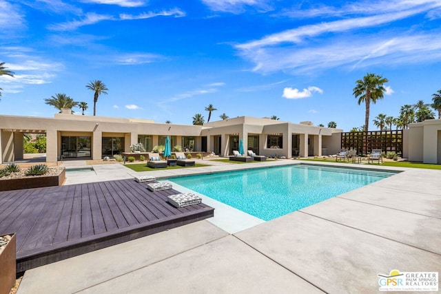 view of pool with outdoor lounge area and a patio area