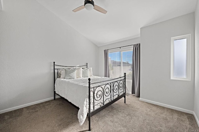 bedroom featuring lofted ceiling, ceiling fan, and carpet flooring