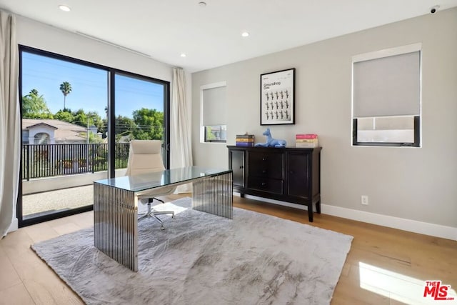 home office featuring light hardwood / wood-style floors