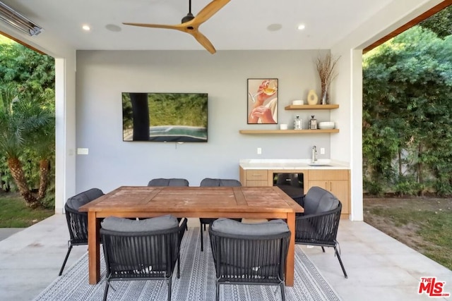 view of patio / terrace featuring ceiling fan and sink