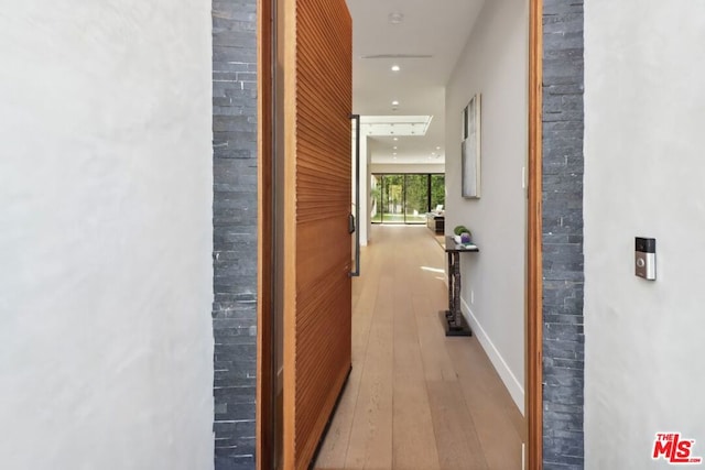 hallway with light wood-type flooring