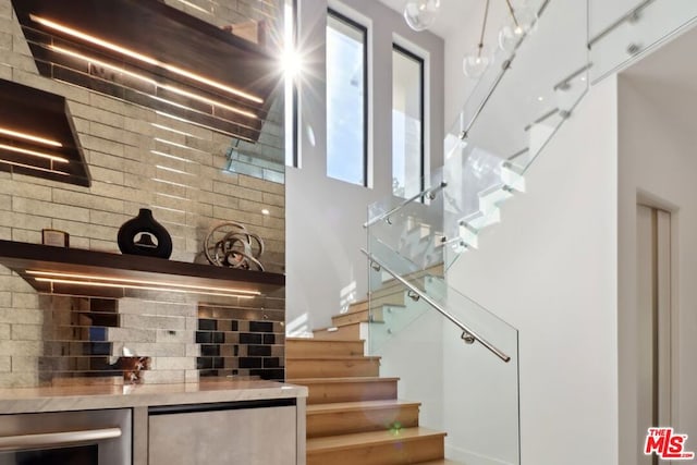 bar featuring white cabinets and beverage cooler