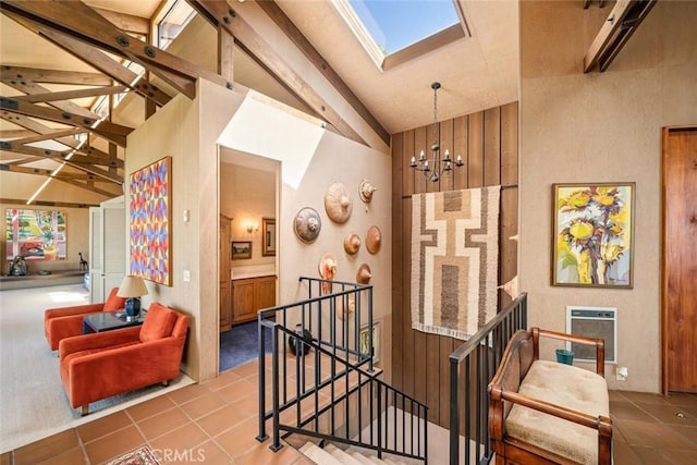 staircase featuring tile patterned flooring, high vaulted ceiling, an inviting chandelier, and beamed ceiling