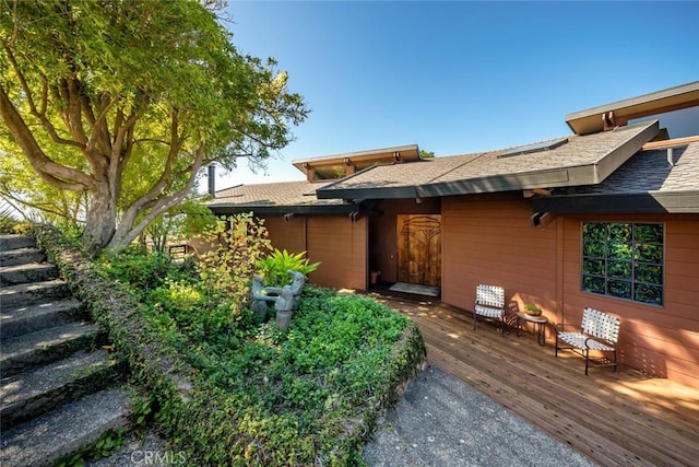 doorway to property featuring a wooden deck