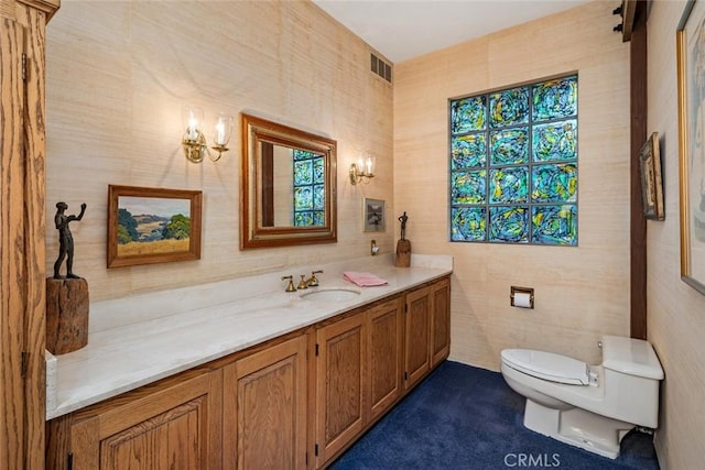 bathroom with vanity and toilet