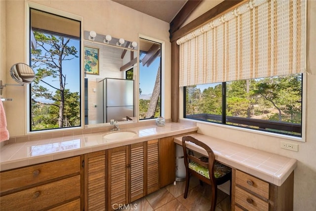 bathroom with tile patterned flooring and vanity