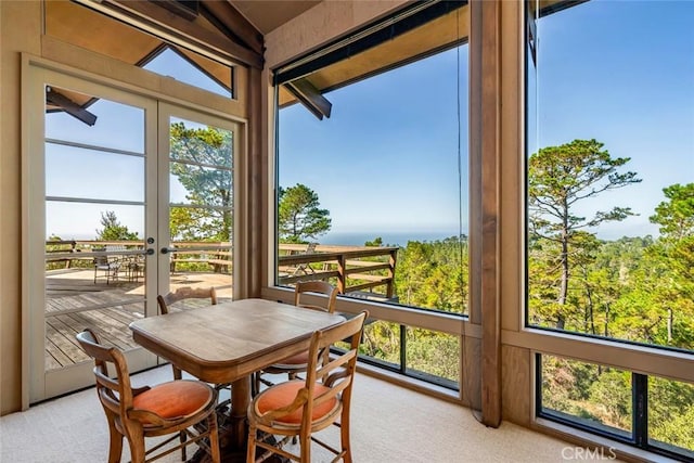 sunroom / solarium with plenty of natural light and lofted ceiling