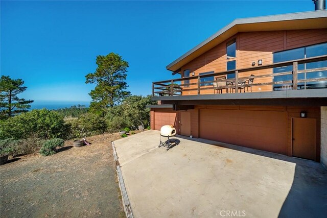 view of patio / terrace with a garage