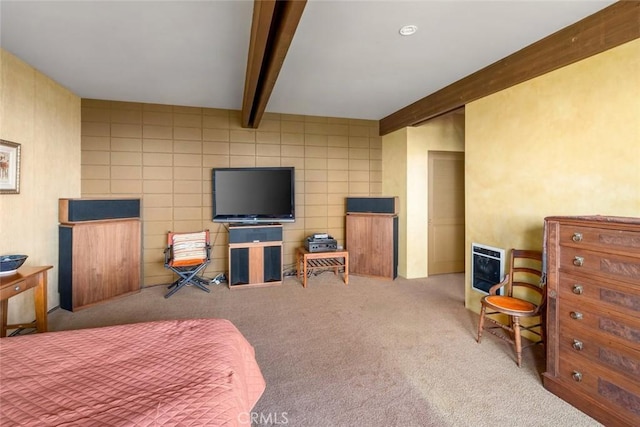 carpeted bedroom featuring beamed ceiling and tile walls