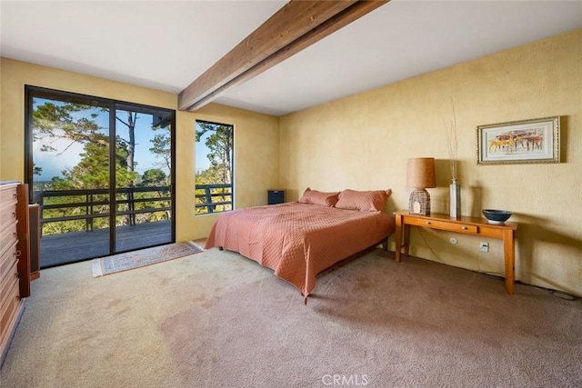 bedroom with carpet flooring, beam ceiling, and access to exterior