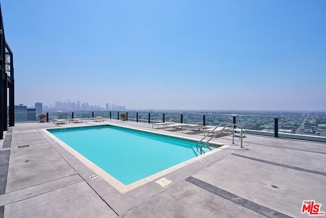 view of pool featuring a patio area