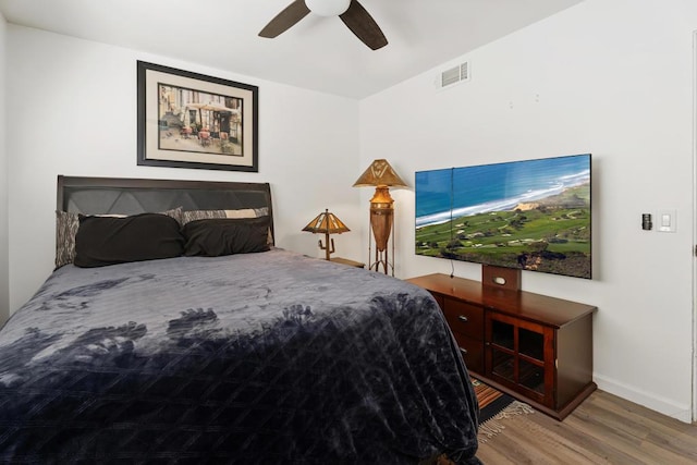 bedroom with hardwood / wood-style flooring and ceiling fan