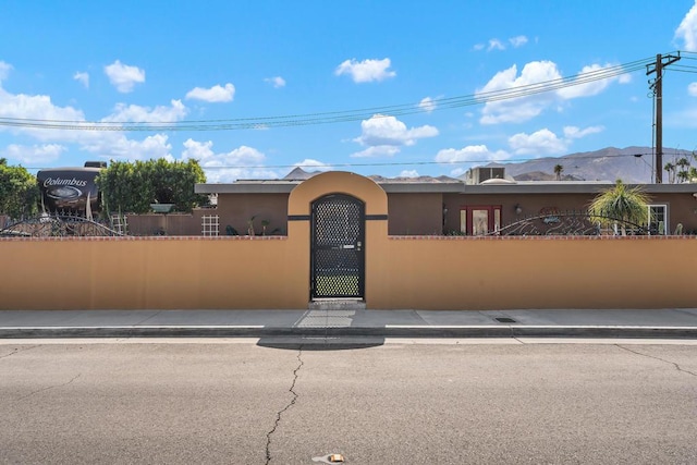 view of front of property with a mountain view