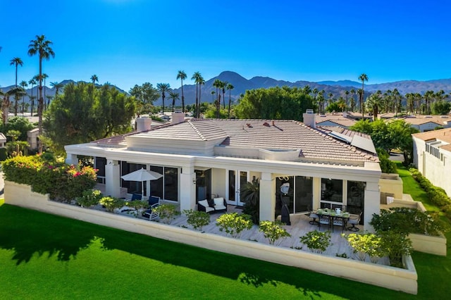 rear view of property with a mountain view