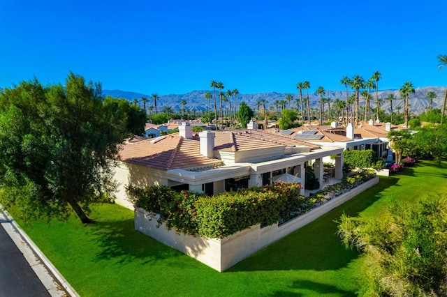 birds eye view of property with a mountain view