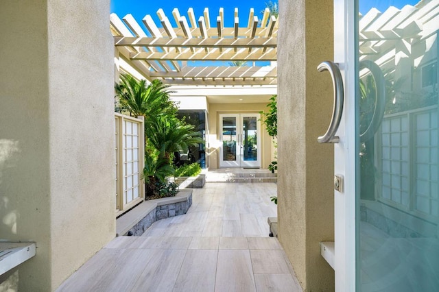 view of patio / terrace featuring a pergola and french doors