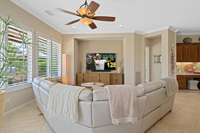 tiled living room featuring ceiling fan and ornamental molding