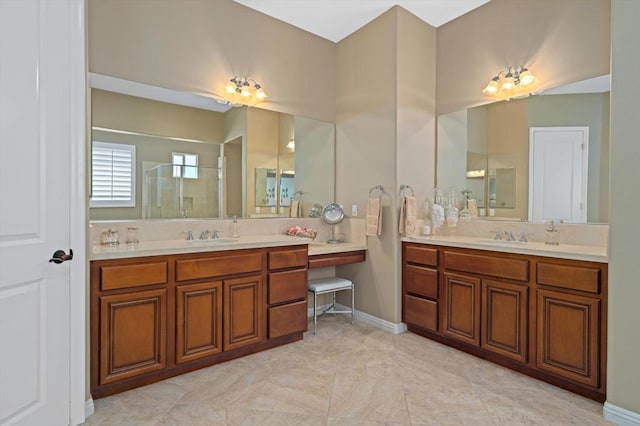 bathroom with vanity and a shower with shower door