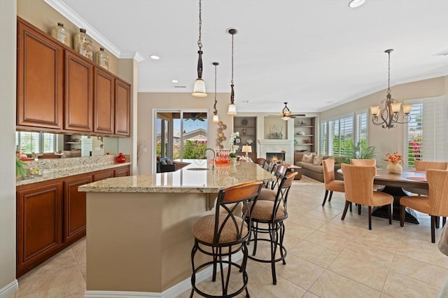 kitchen with a wealth of natural light, a large island, and pendant lighting