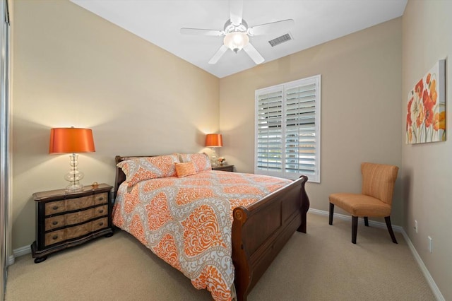 bedroom with light carpet and ceiling fan